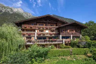 a sign in front of a mountain at Auberge du Bois Prin in Chamonix-Mont-Blanc