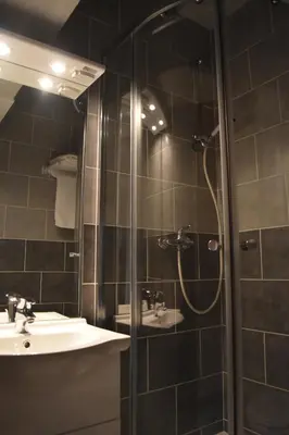 a bathroom with a shower and a sink at Résidence Le Fontenay in Plateau dʼAssy