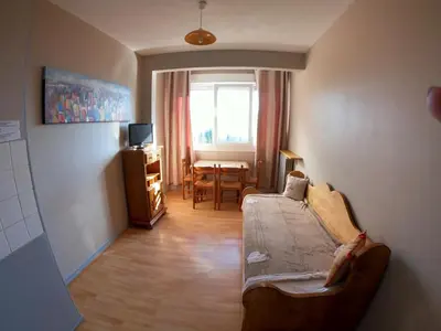 a small room with a bed and a dining room at Résidence Le Fontenay in Plateau dʼAssy