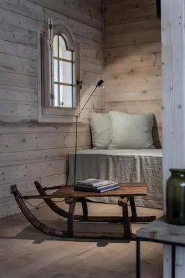 a room with a table and a bed with a window at Le Cerf Amoureux Chalet Privé & Spa in Sallanches