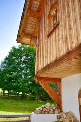 a tree house with a pile of rocks underneath it at Le Cerf Amoureux Chalet Privé & Spa in Sallanches