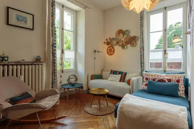 a living room with a couch and a chair at Appartement Cocon in Chamonix-Mont-Blanc