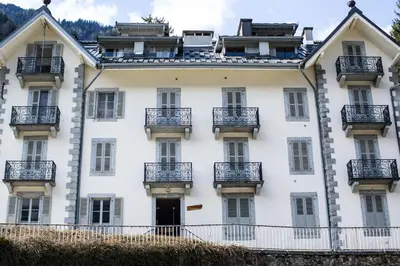 a large white building with balconies on it at Appartement Cocon in Chamonix-Mont-Blanc