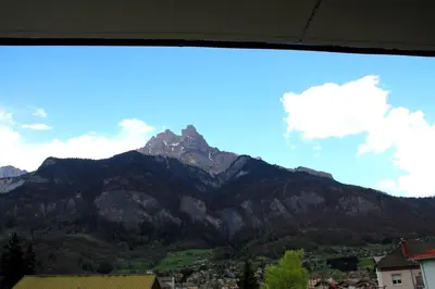 a mountain view of a city and a town at Appartement au pied du Mont-Blanc ! in Sallanches