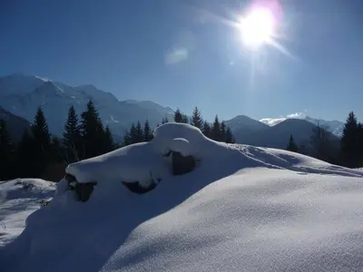 a pile of snow on top of a snow covered mountain at Résidence Les Jorasses in Servoz