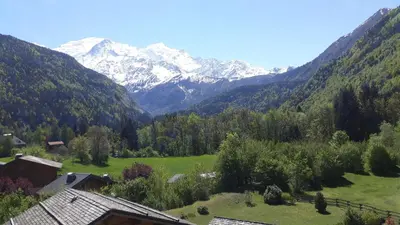 a view of a valley with snow capped mountains at Résidence Les Jorasses in Servoz