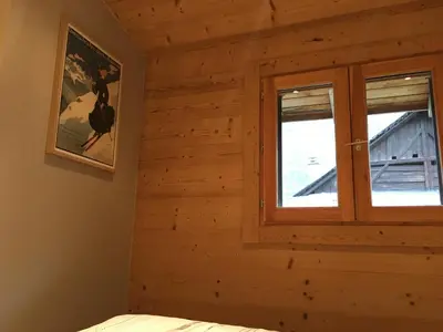 a room with a window in a log cabin at La Para in Chamonix-Mont-Blanc