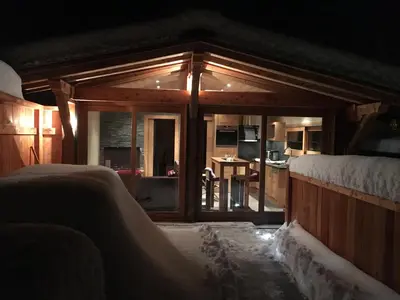a house with snow on the floor and a living room at La Para in Chamonix-Mont-Blanc