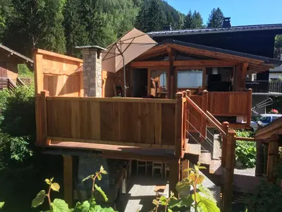 a house with a wrap around porch and a deck at La Para in Chamonix-Mont-Blanc