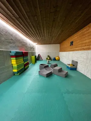 a room with couches and a wooden ceiling at Fontaine du Mont Blanc Hotel & Spa in Les Houches