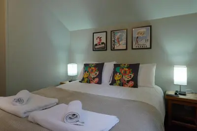 a bedroom with a bed with towels on it at Vert Lodge Chamonix in Chamonix-Mont-Blanc