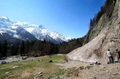 a group of people standing on a hill near a mountain at Vert Lodge Chamonix in Chamonix-Mont-Blanc