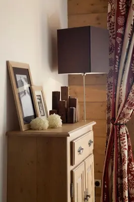 a lamp on top of a dresser in a room at CGH Résidences & Spas La Reine des Prés in Samoëns
