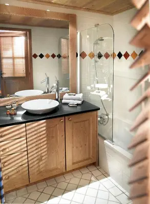 a bathroom with a sink and a shower at CGH Résidences & Spas La Reine des Prés in Samoëns