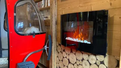 a fireplace in a room with a fire place at Hôtel Les Cimes in Megève