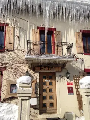 a hotel with icicles hanging from a building at Hôtel Les Cimes in Megève