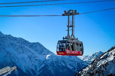 a ski lift over a snow covered mountain at Chalet Les Frenes in Chamonix-Mont-Blanc