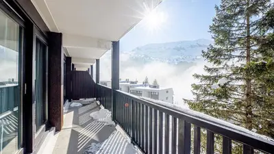 a balcony with a view of a snow covered mountain at Madame Vacances Les Terrasses De Véret in Flaine