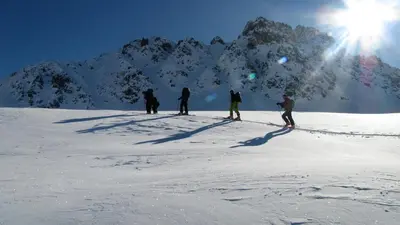 a group of people standing on top of a snow covered mountain at Hôtel Val d'Este in Saint-Gervais-les-Bains