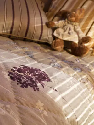 a couple of teddy bears sitting on a bed at CGH Résidence Boutique Le Hameau De Pierre Blanche in Les Houches