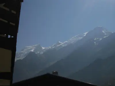 a view of a mountain range with snow capped mountains at Le Prarion 2 in Les Houches