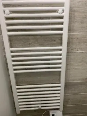 a white metal shelf in a room at Le Prarion 2 in Les Houches