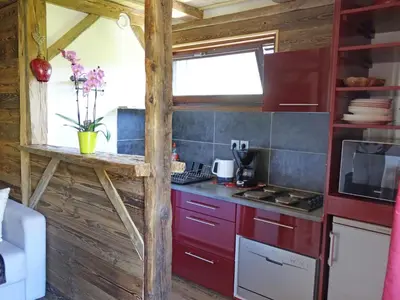 a dining room with a table and a television at Studio Castel des roches by Interhome in Saint-Gervais-les-Bains