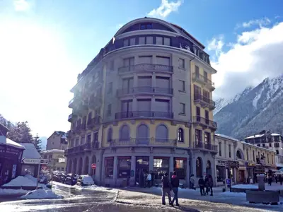 a large building in front of a mountain at Apartment Le Carlton-7 by Interhome in Chamonix-Mont-Blanc