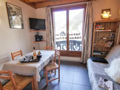 a kitchen and dining room with a table and a window at Apartment Le Triolet-8 by Interhome in Chamonix-Mont-Blanc
