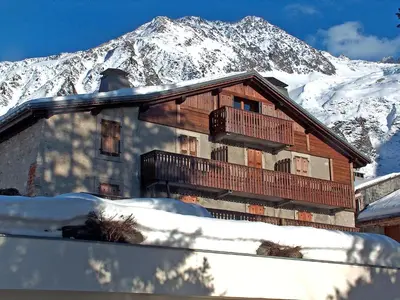 a house in the snow with a snow covered mountain at Apartment Chalet Le Tour by Interhome in Chamonix-Mont-Blanc