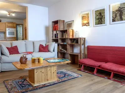 a living room with a couch and a red bench at Apartment Chalet Le Tour by Interhome in Chamonix-Mont-Blanc