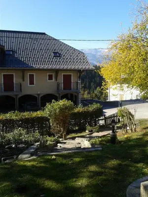 a house with a view of a yard at Les Clarines in Saint-Gervais-les-Bains