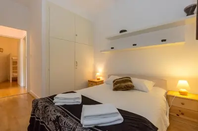 a bedroom with a bed with towels on it at Summit Apartment - Chamonix in Chamonix-Mont-Blanc