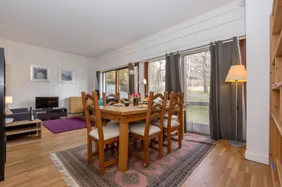 a dining room with a table and chairs at Summit Apartment - Chamonix in Chamonix-Mont-Blanc