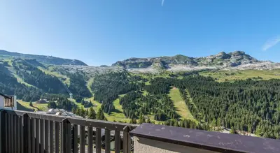 a bedroom with a bed and a large window at Résidence Pierre & Vacances La Forêt in Flaine