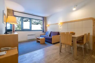 a living room with couches and a table at Résidence Pierre & Vacances La Forêt in Flaine