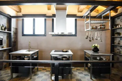 a kitchen with two sinks and a counter in a room at Chalets Grands Montets in Chamonix-Mont-Blanc