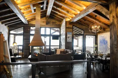 a living room with a couch and a table at Chalets Grands Montets in Chamonix-Mont-Blanc