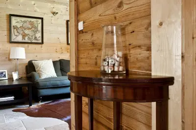a living room with a table with a glass jar on it at Chalet Amelie in Chamonix-Mont-Blanc