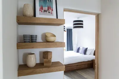a bedroom with a mirror and a bed in it at Le Brevent 3 Apartment in Chamonix-Mont-Blanc