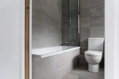 a bathroom with a tub and a toilet and a shower at Le Brevent 3 Apartment in Chamonix-Mont-Blanc