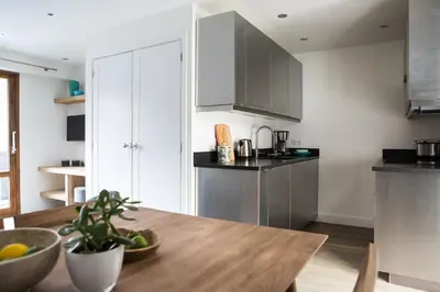 a kitchen with a wooden table in a room at Le Brevent 3 Apartment in Chamonix-Mont-Blanc
