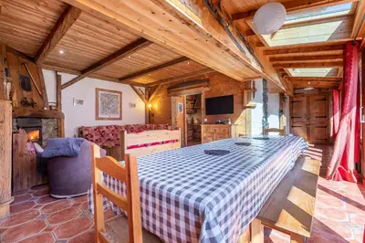 a room with a table with a checkered table cloth at Chalet Quatre Saisons in Saint-Gervais-les-Bains
