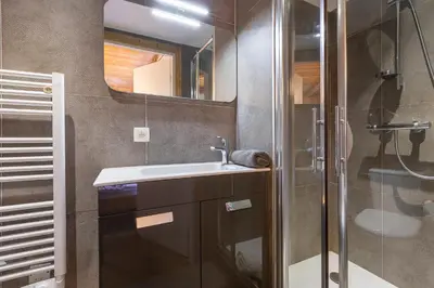 a bathroom with a sink and a shower at Chalet Quatre Saisons in Saint-Gervais-les-Bains