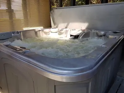 a jacuzzi tub with water in it at Chalet Quatre Saisons in Saint-Gervais-les-Bains