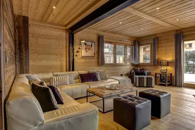 a living room with a couch and a table at Chalet Planards 1 in Chamonix-Mont-Blanc