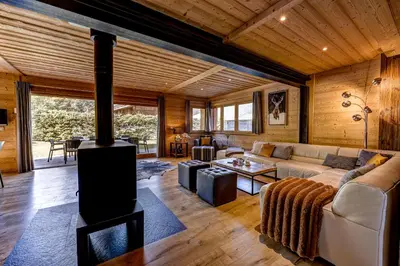a living room with a fireplace in a house at Chalet Planards 2 in Chamonix-Mont-Blanc