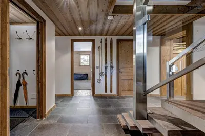 a hallway of a house with wooden ceilings at Chalet les Sauberands in Chamonix-Mont-Blanc