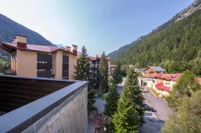 a resort in the mountains with snow covered trees at Résidence Grand Roc - Campanules 303 - Happy Rentals in Chamonix-Mont-Blanc