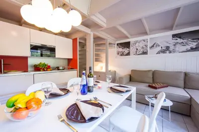 a large building in the snow in front at Résidence Grand Roc - Campanules 303 - Happy Rentals in Chamonix-Mont-Blanc